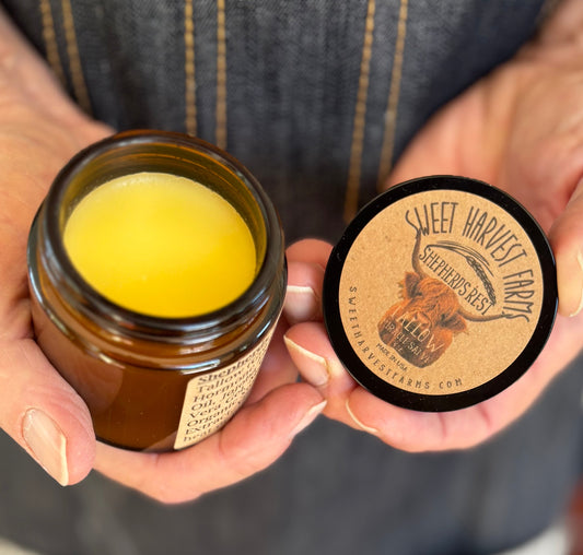 Organic Shepherds Rest Tallow Miracle Salve by Sweet Harvest Farms in a jar, showing creamy texture and natural ingredients.