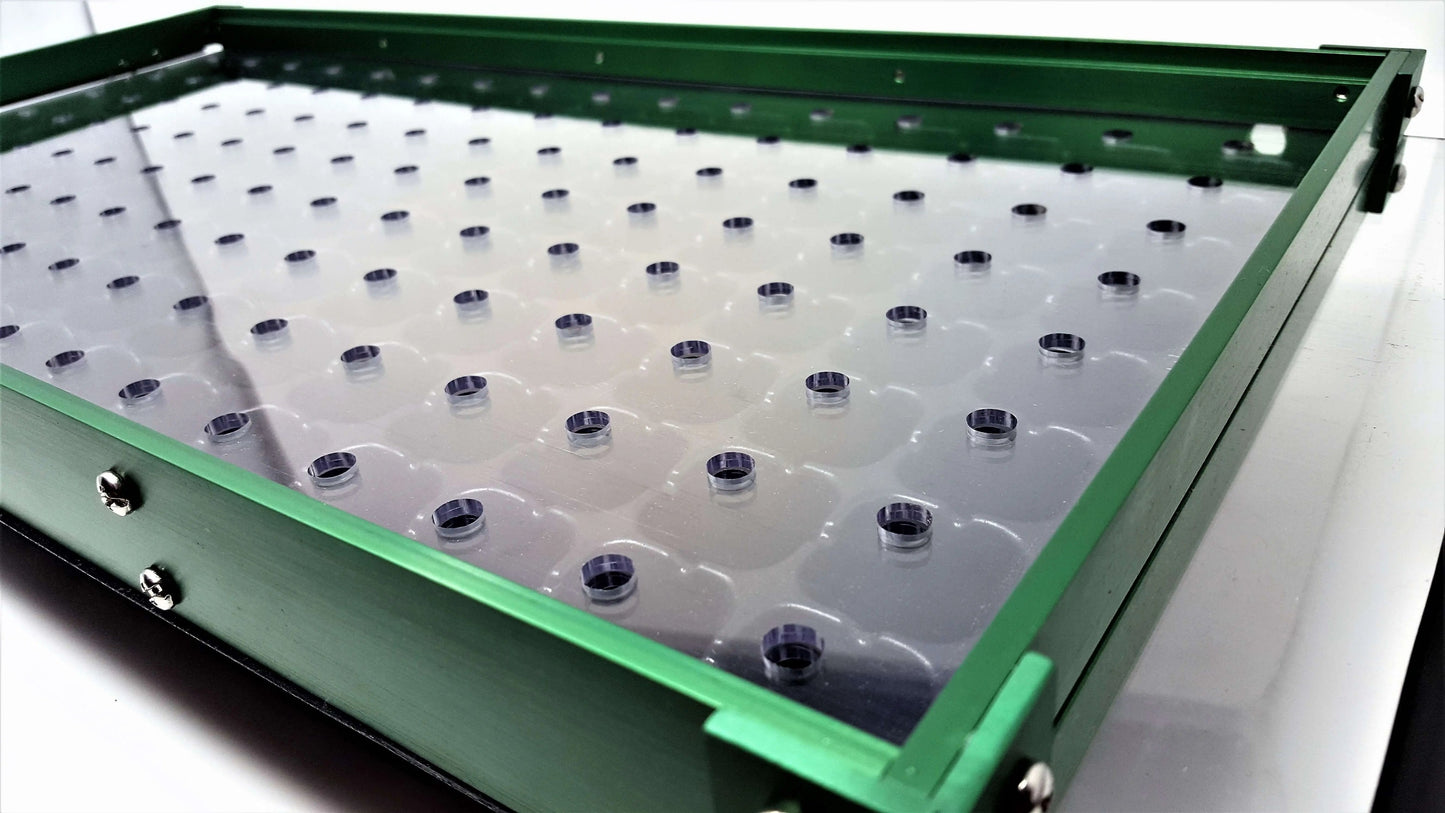 Bootstrap Farmer Drop Seeder Plates for seeders, showing metal plates used for precise seed distribution in planting.