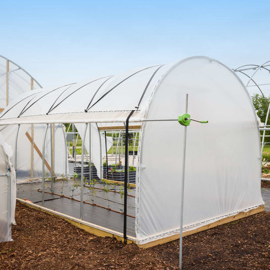 Bootstrap Farmer 10' Essential High Tunnel Kit with roll-up sides and end wall door, showing the greenhouse structure with open sides.