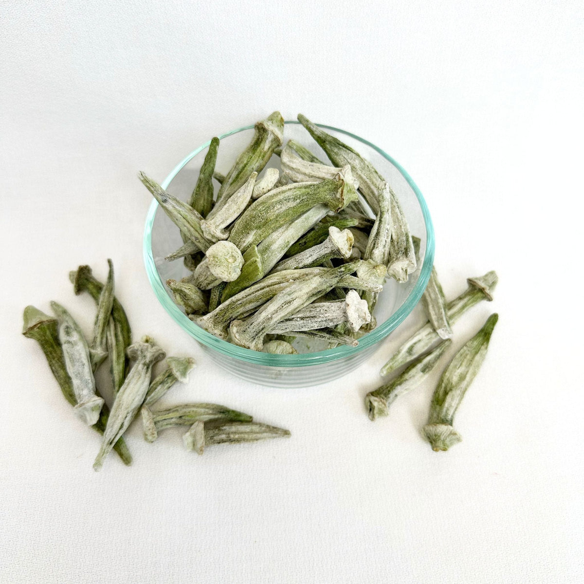 Freeze dried okra by Double L Ranch shown in a close-up image with vibrant green, crunchy texture, and sliced pieces.