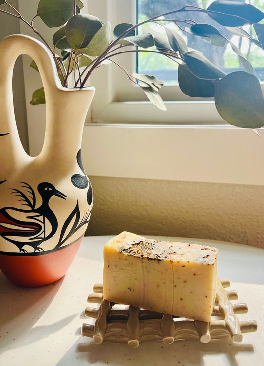 Sweet Harvest Farms Ministry Handmade Organic Soap with Thieves Oil formulation, featuring natural herbal ingredients and a rustic appearance.