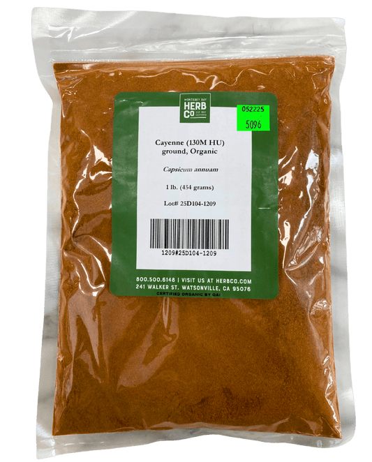 Ground cayenne pepper from Country Life Natural Foods, organic herbs in a jar, showing vibrant red powder and spice label.