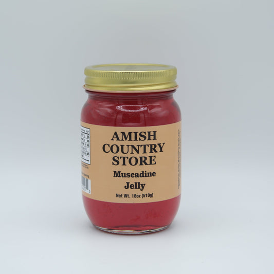 Canned Muscadine Jelly in an 18oz jar from Amish Country Store, with a clear label and lid on a wooden surface.