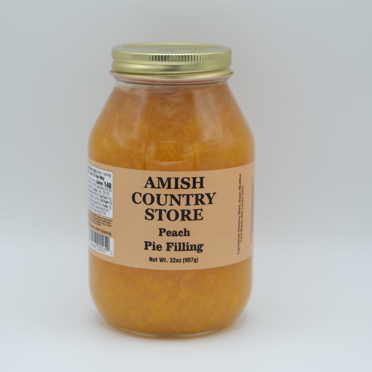 Amish Country Store peach pie filling in a jar, showcasing fresh peach chunks and syrup, perfect for baking desserts