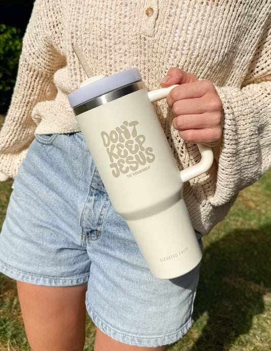 Elevated Faith 40 oz tumbler with "Don't Keep Jesus to Yourself" message, stainless steel, and spill-proof lid.