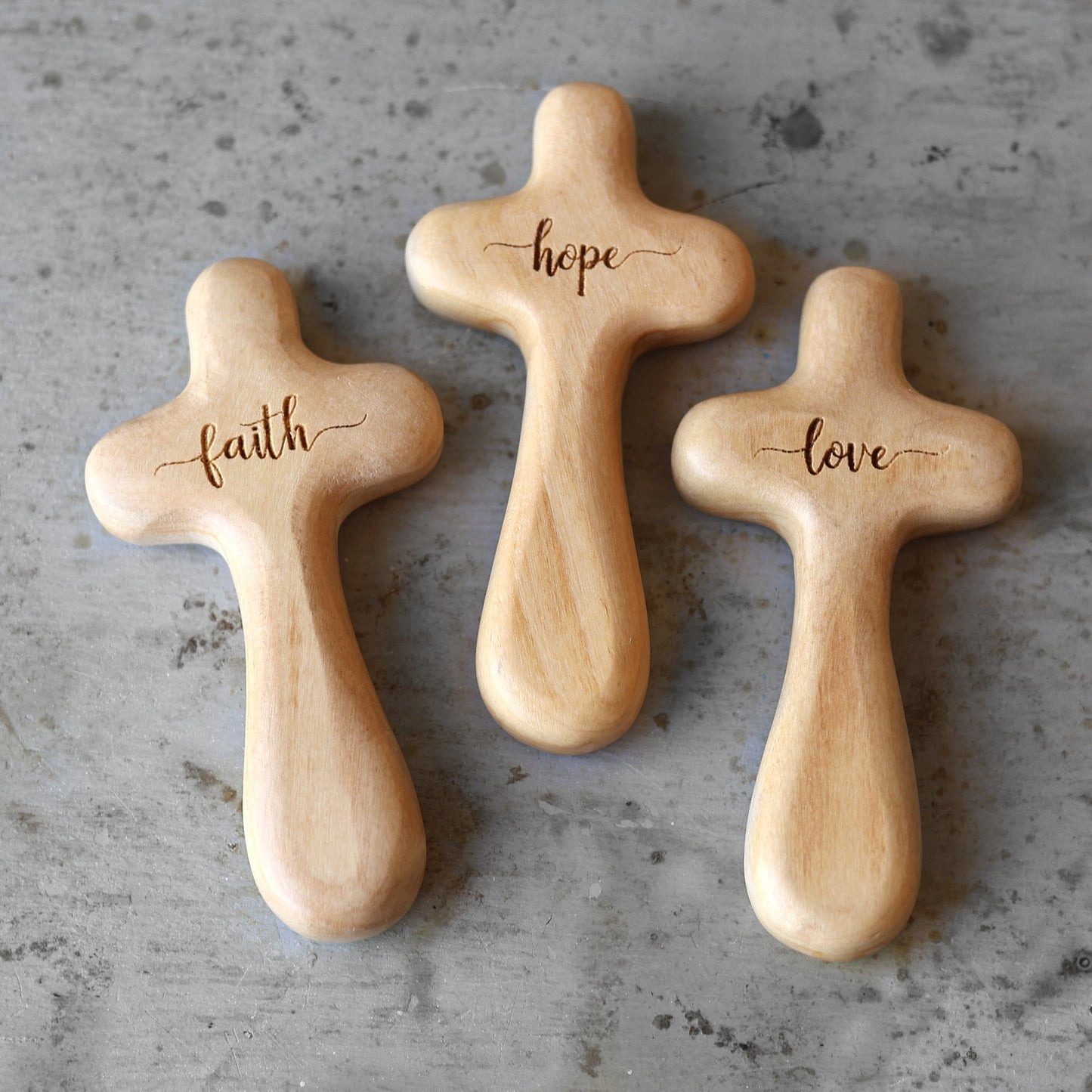Wooden engraved prayer cross from the Holy Land by Dennehey Design Co., featuring detailed religious carvings.