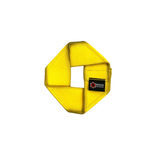 Yellow Fire Hose Dog Frisbee JR, a durable dog toy from Recycled Firefighter, designed for fetch and outdoor play.