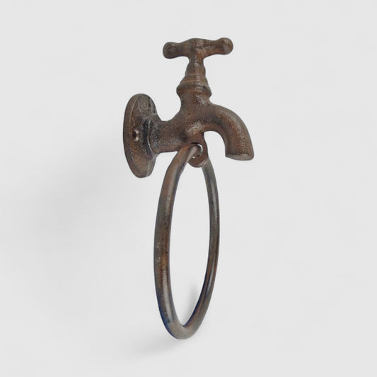 Iron & Blossom Quirky cast iron faucet towel holder with industrial farmhouse style, mounted on bathroom wall for towel storage.