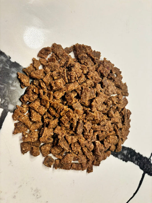 Organic beef training treats for dogs, high-value training bites from PAWsitively Organic Dog Bakery, shown in a close-up image.
