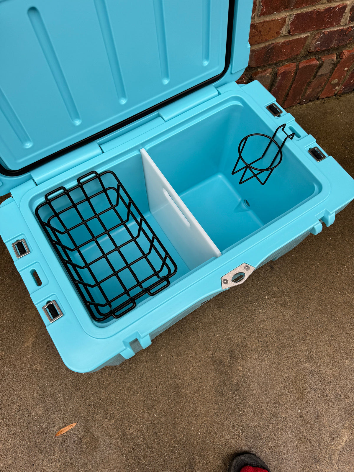 Polar Bear 45 Hard Cooler with black lid and body, rugged design, and sturdy handles for outdoor cooling needs.