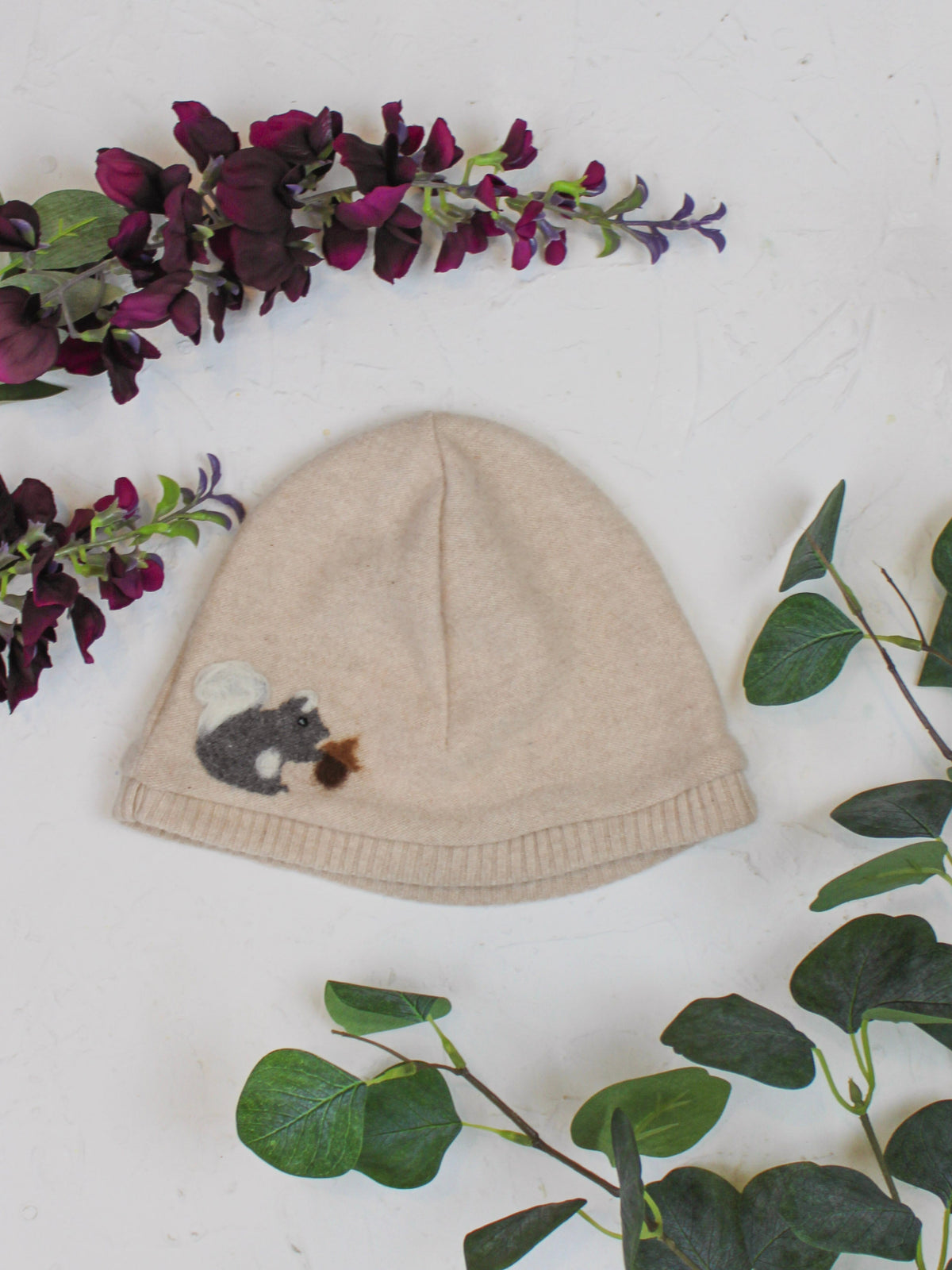 Child's squirrel-pattern cashmere hat by Ash & Rose, soft and cozy knit with cute squirrel design for warmth and style.