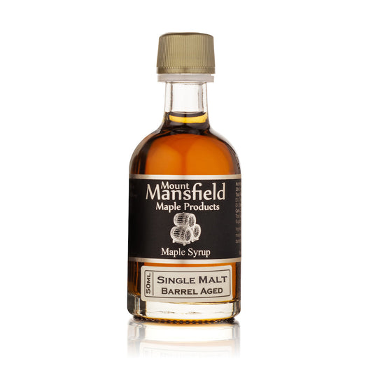 50ml bottle of Mount Mansfield Barrel Aged Vermont Maple Syrup with a label featuring maple leaves and barrel aging description.