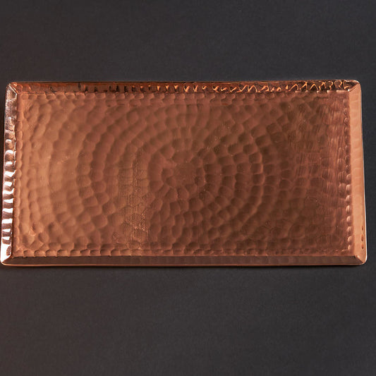 Copper serving tray by Sertodo with a chequered pattern, ideal for serving plates and platters in a stylish kitchen setting.