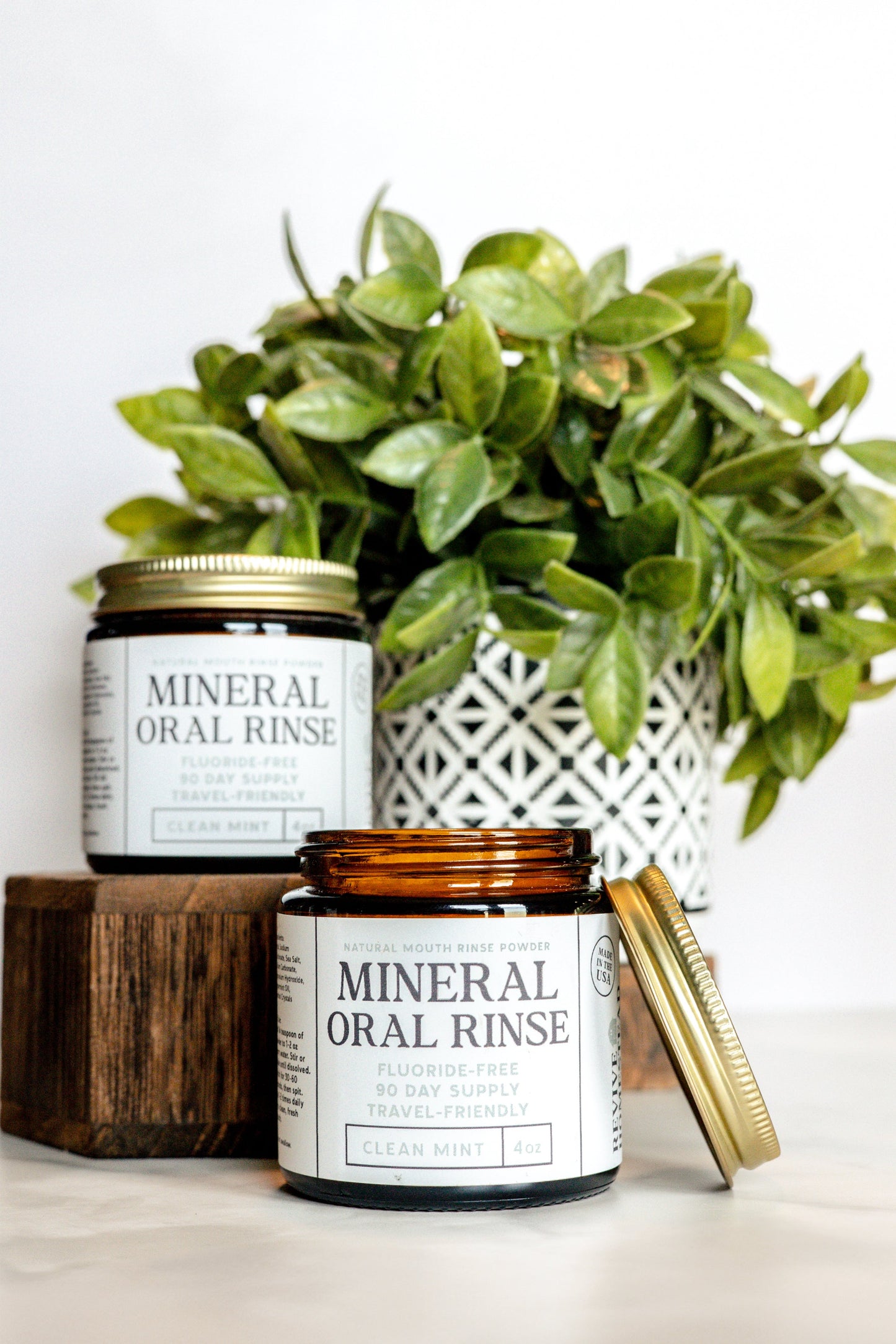 Natural oral rinse by Revive Homestead, featuring a clear bottle of mouthwash with herbal ingredients for fresh breath and oral health.