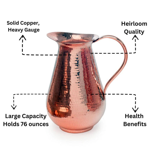 Solid Sertodo copper water pitcher with a traditional design, featuring a polished finish and sturdy handle for serving beverages.