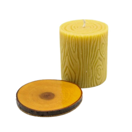 Beeswax candle with wooden base, 12 oz, from Buzz Savories LLC, in a cozy home and garden setting.