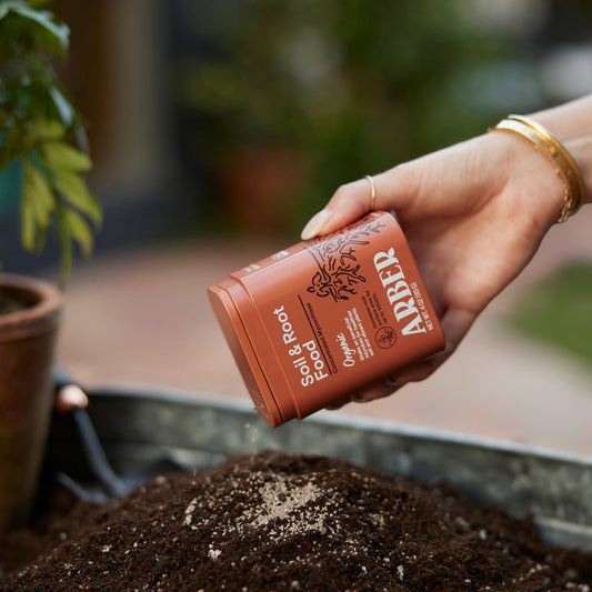Organic Soil and Root Boost by Arber, natural fertilizer for healthy plant growth and strong roots, shown in the image.