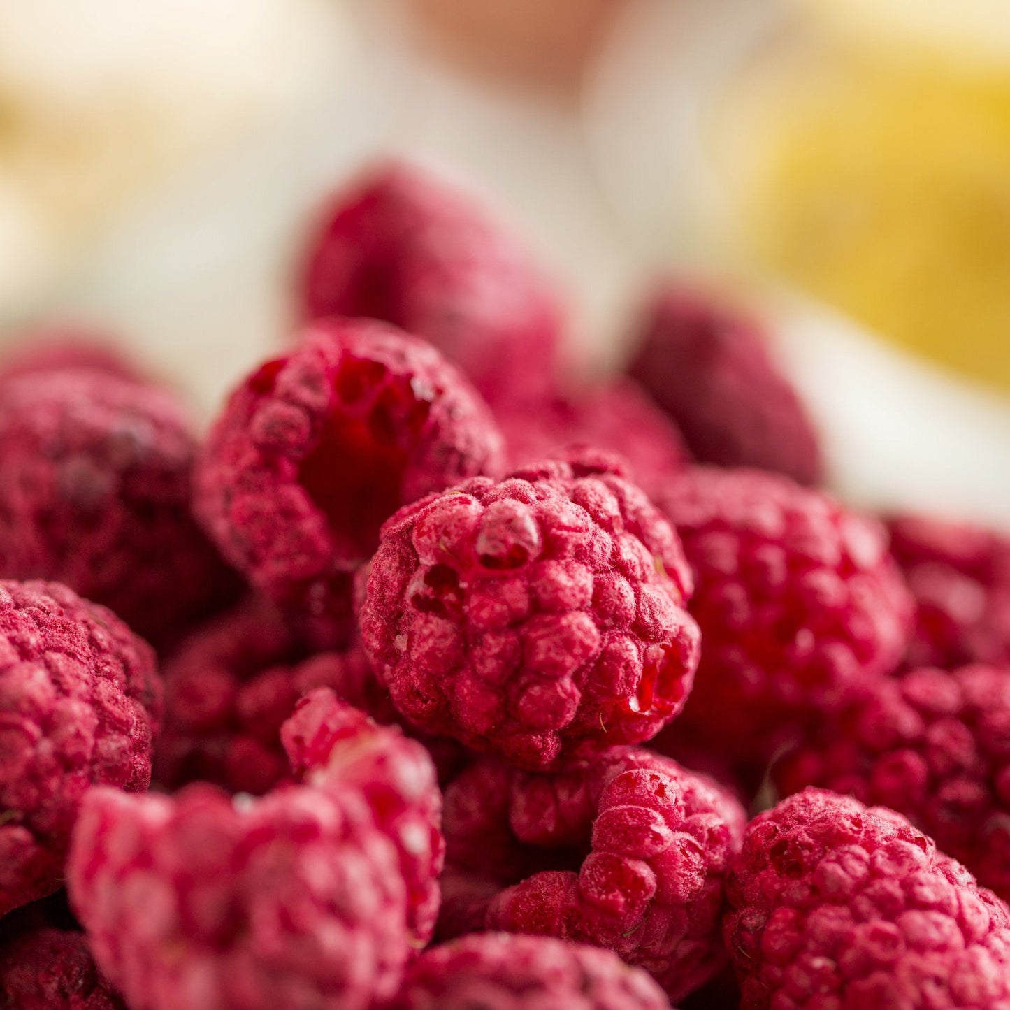 Canned Augason Farms freeze-dried whole raspberries in a can, offering 23 servings of dried berry snack or ingredient.