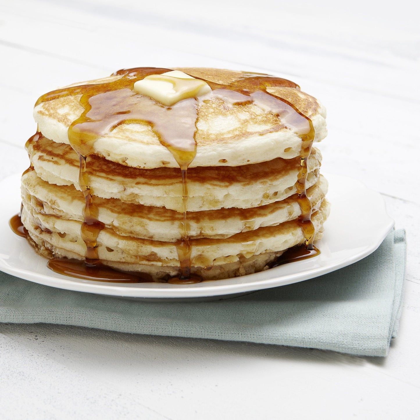 Augason Farms buttermilk pancake and waffle mix can, 33 servings, with a label showing the product inside
