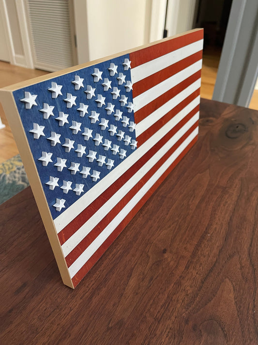 Mini stained American flag wall decor by AVEL Woodworking featuring a detailed, rustic wooden American flag for home decoration.