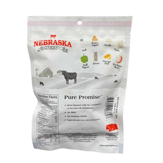 Back view of 3 oz Red Pepper Beef Jerky from Nebraska Star Beef, showing the dried, seasoned beef slices on a white surface.