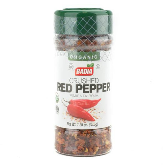 Organic crushed red pepper from Badia Herbs in a clear container, shown with vibrant red crushed spice on top.