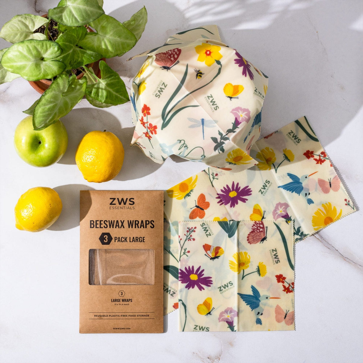 Set of three large beeswax wraps with pollinator illustrations from ZeroWasteStore, plastic-free food storage wraps for fresh food.