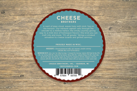 Smoked Gouda cheese from Cheese Brothers, Inc., showing a block of rich, golden smoked Gouda cheese with smooth texture.
