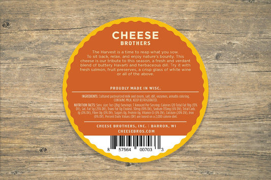 Creamy Dill Havarti cheese from Cheese Brothers, Inc., sliced and ready to enjoy with herbs and smooth texture.