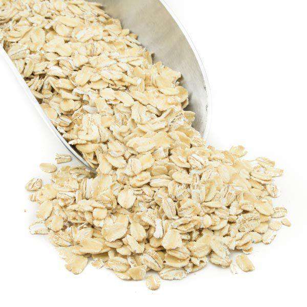 Country Life Natural Foods gluten-free regular rolled oats in a 50lb bag, showing the oats' texture and packaging.