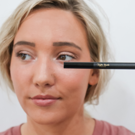 Deep taupe Taylor Made Organics retractable brow pencil for natural-looking eyebrow enhancement and precise shaping.