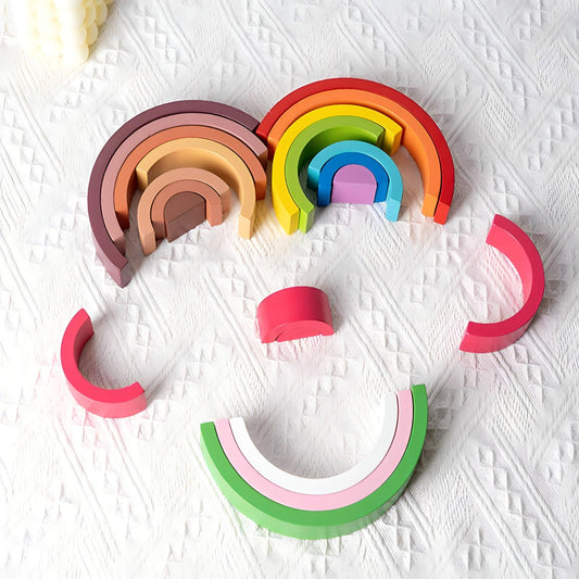 Small wooden rainbow arch blocks by Petite Pioneers, colorful and smooth baby toy for stacking and imaginative play.