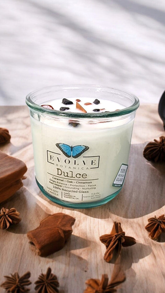 Evolve Botanica Rocks Candle Dulce with wood wick, red jasper and onyx gemstones, in a soy wax candle holder.