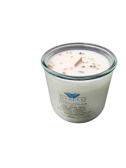 Evergreen Rocks Candle by Evolve Botanica featuring a wood wick, Peridot and Smoky Quartz gemstones, soy wax, and natural design.