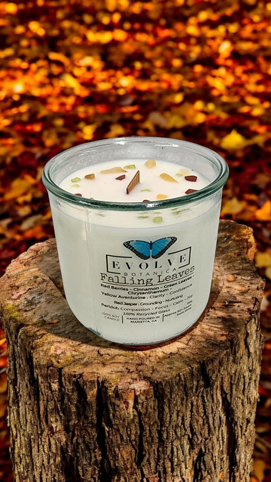 Rocks Candle Falling Leaves soy candle by Evolve Botanica with wood wick, Peridot, Red Jasper, and Yellow Aventurine gemstones.