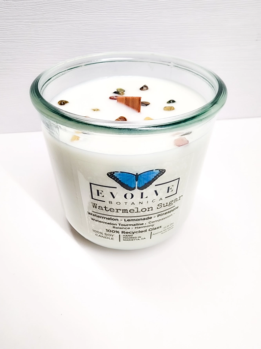 Evolve Botanica Watermelon Sugar Rocks Candle with wood wick and gemstone, soy wax, decorative candle for ambiance.