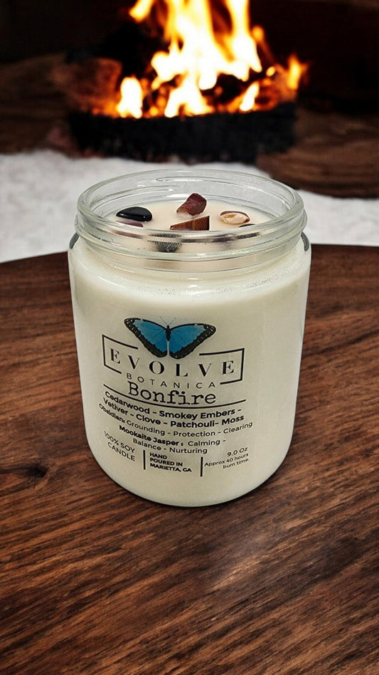 Classic 9oz Jam Jar crystal soy candle by Evolve Botanica with obsidian and mookaite stones, natural wood wick, and bonfire scent.