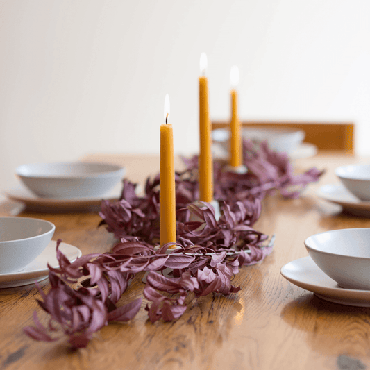 Hand-dipped beeswax taper candles in a 4-pair bundle from Bluecorn Candles, featuring natural, elegant candle design.