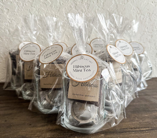 Herbalroseapothecary Hibiscus Mint Tea gift set featuring herbal tea tins with hibiscus and mint for soothing beverage.