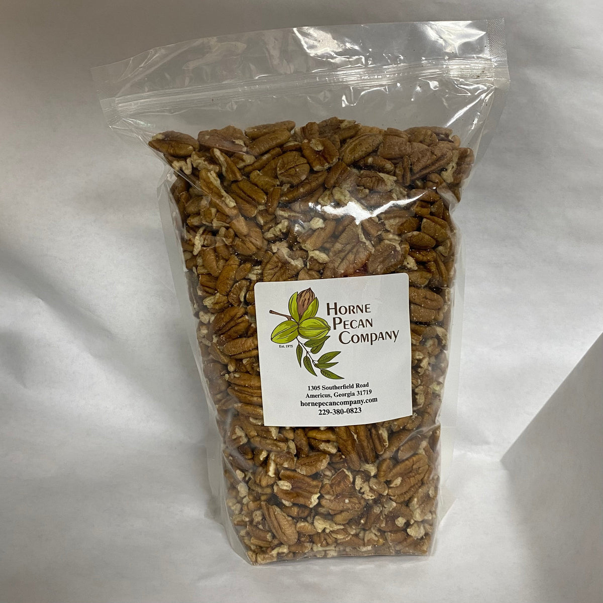 Bulk pecans from Horne Pecan Company in 2lb, 4lb, or 30lb bags, showing fresh pecan halves perfect for snacking or baking.