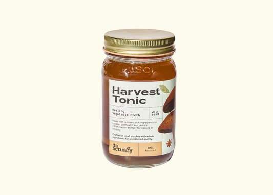 Three 14oz jars of Its Actually Co. Healing Vegetable Broth beverage, showcasing the clear, nourishing vegetable broth in glass jars.