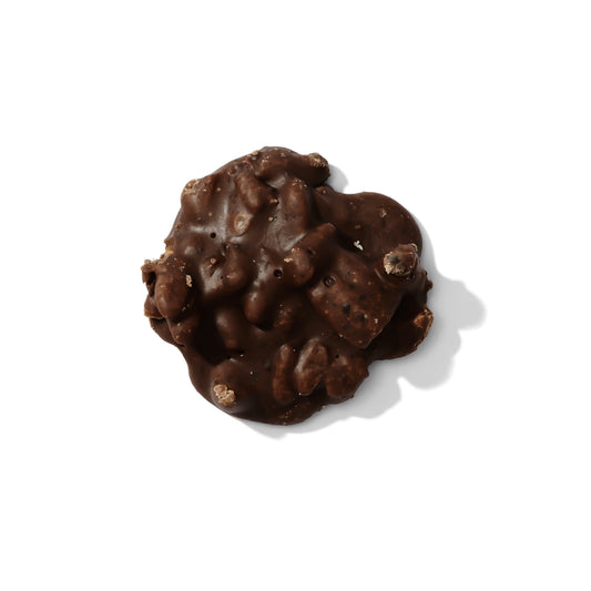 Six Mississippi Mudslide pralines from Louisiana Candy Company, featuring rich chocolate and pecan toppings on creamy candies.