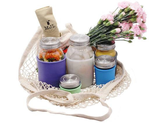 Organic cotton string tote bag with front pocket from Mason Jar Lifestyle, featuring a natural woven design and sturdy handles.
