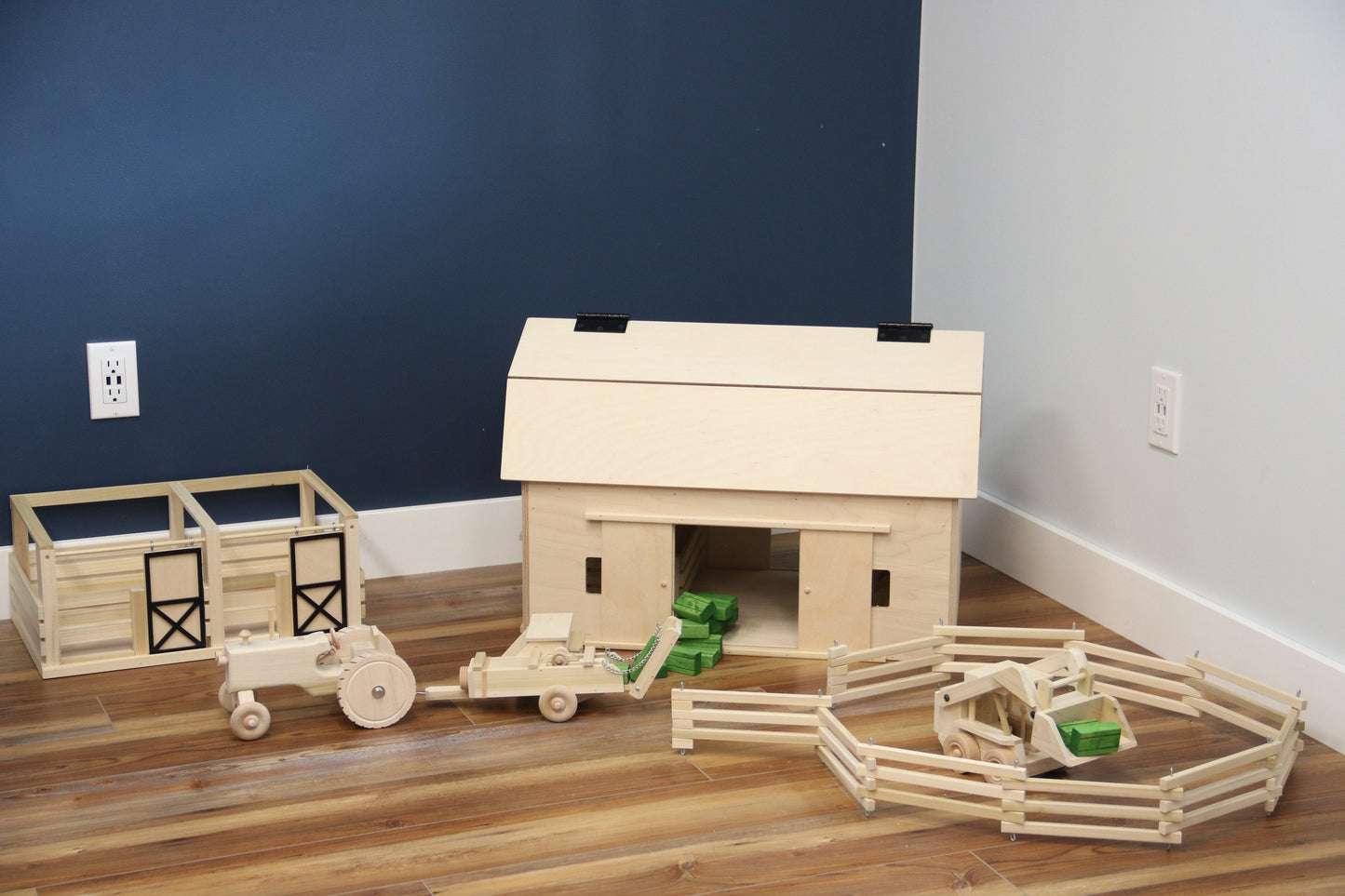 Amish-made unfinished large wooden hip-roof barn toy for children, crafted from natural wood, part of farming wooden toys collection.