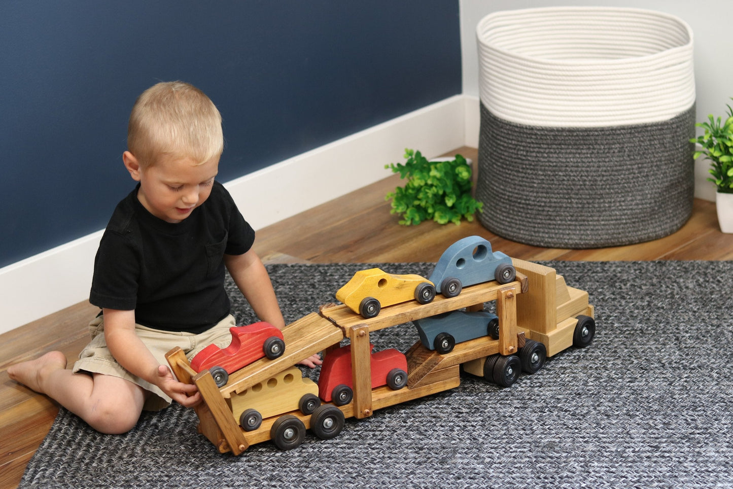 Wooden car-carrier semi truck and trailer toy set with six colorful wooden cars, designed for children by AmishToyBox.com.