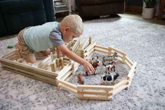 Amish-made wooden folding corral fence toy, 68 inches long, with detailed natural wood finish and sturdy construction.
