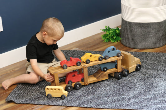 Wooden car carrier semi truck and trailer toy set with six colorful wooden cars, suitable for children, by AmishToyBox.com.