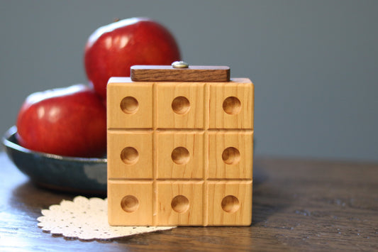 Wooden marble tic tac toe game with built-in storage, featuring natural wood finish and colorful marbles for kids' wooden toy play.