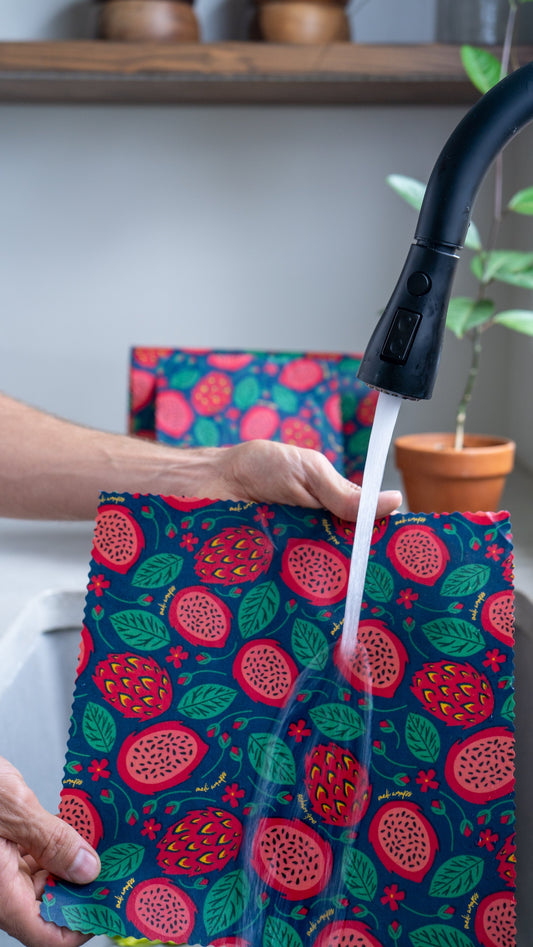 Set of three Meli Wraps beeswax food wraps in dragonfruit print, small, medium, and large sizes for eco-friendly food storage.