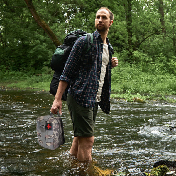 125-in-1 Mercantile Mountain survival kit with camping, hiking, and emergency SOS gear displayed in a compact case.
